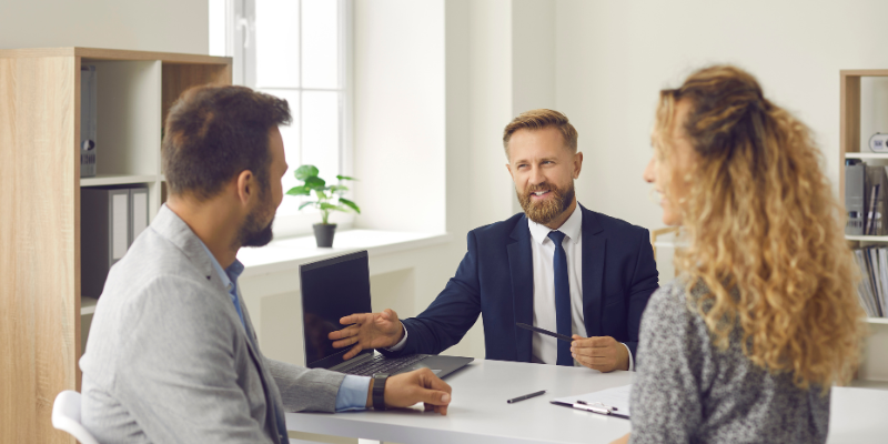 salesman talking with two clients