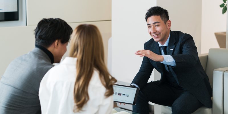 salesmen talking to two potential clients