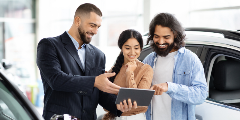 man showing customers a quote