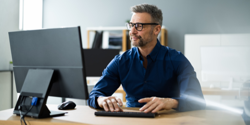 man working on home computer