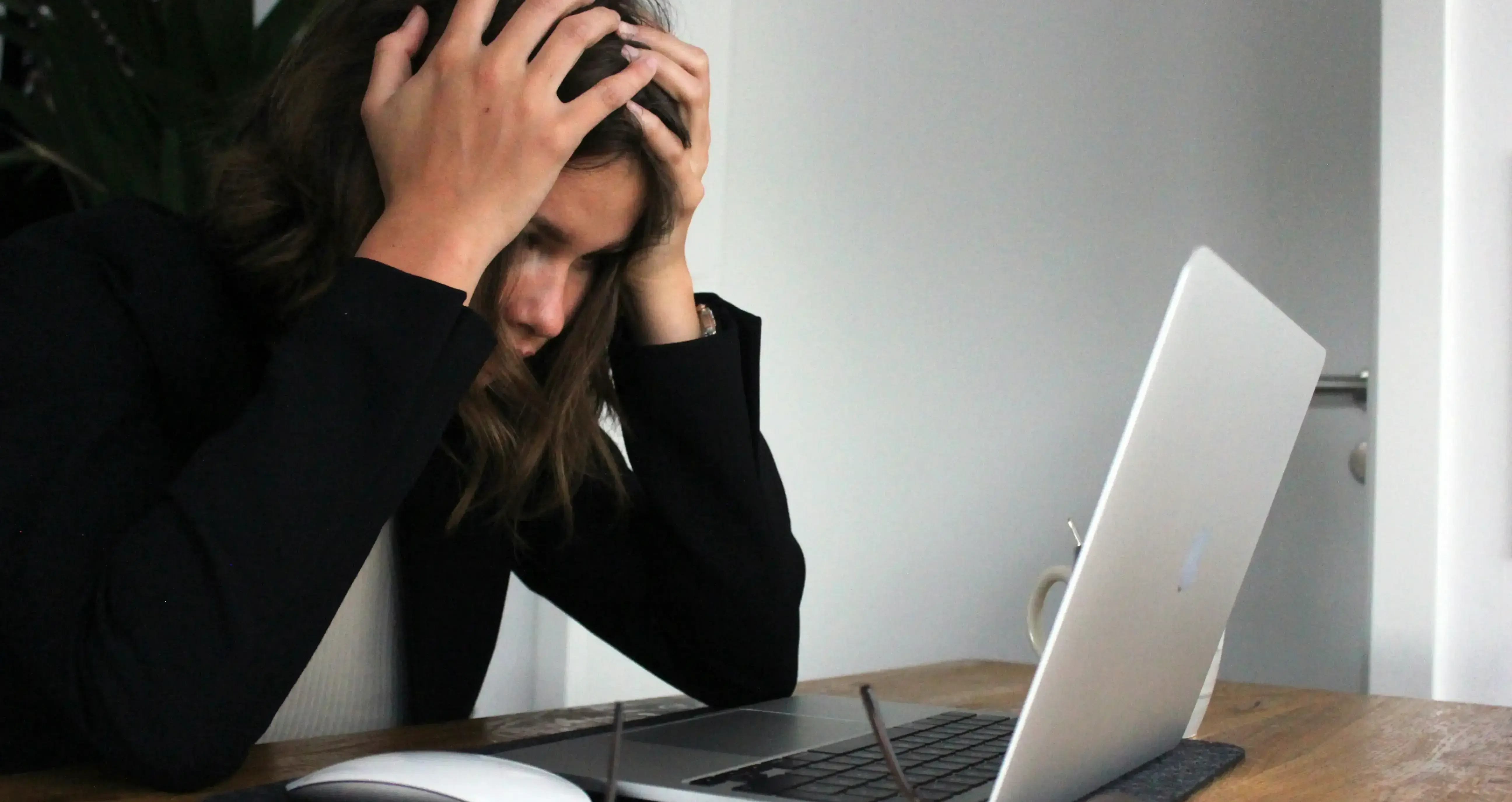 Woman frustrated while working on computer